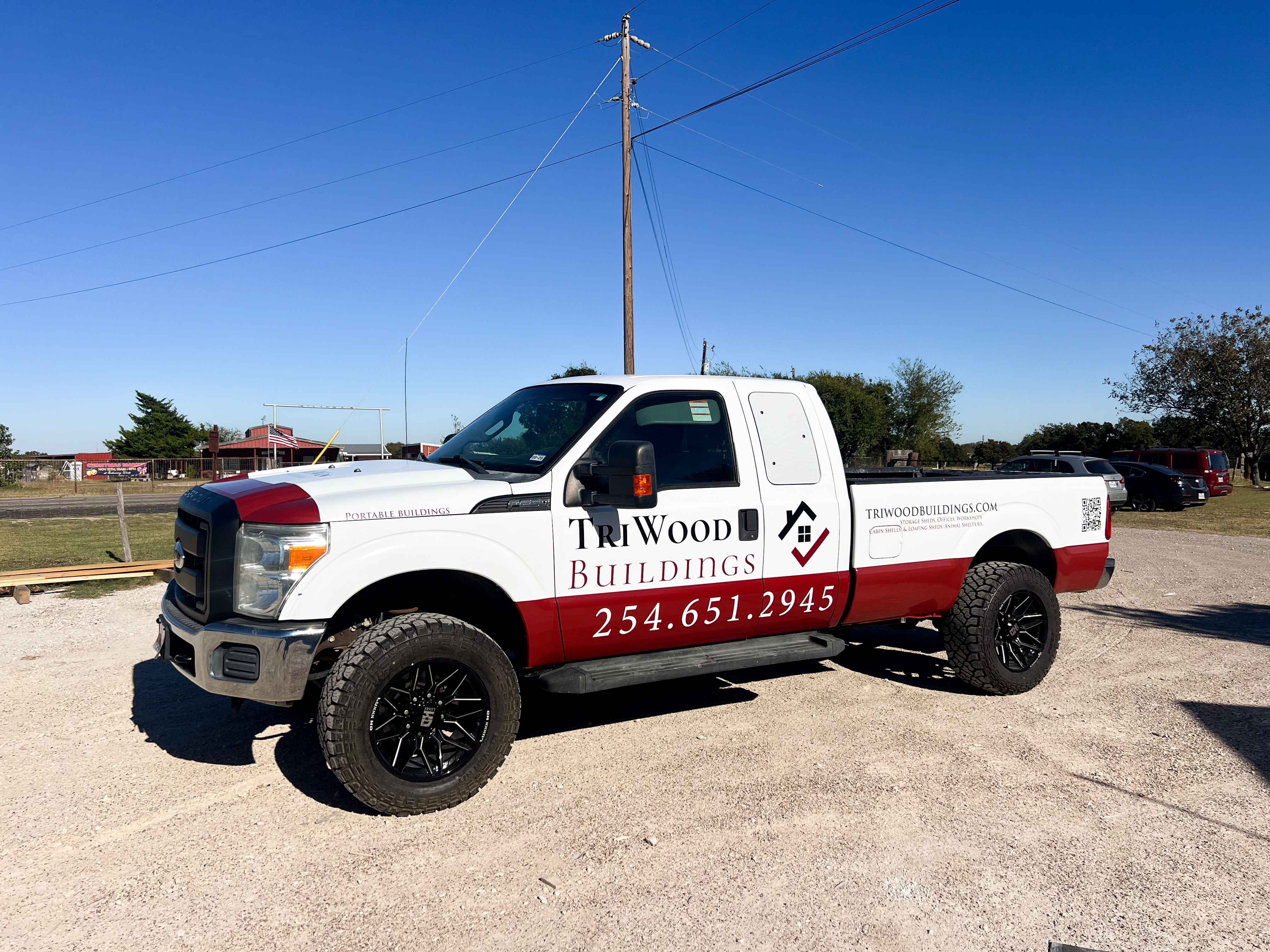 Row of TriWood loafing sheds on a lot